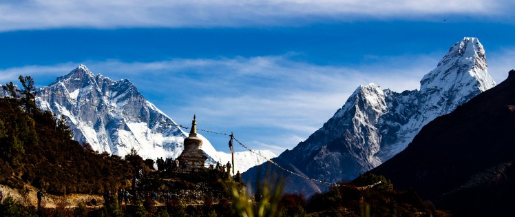 Serene Mountain Stupa Amidst Scenic Peaks